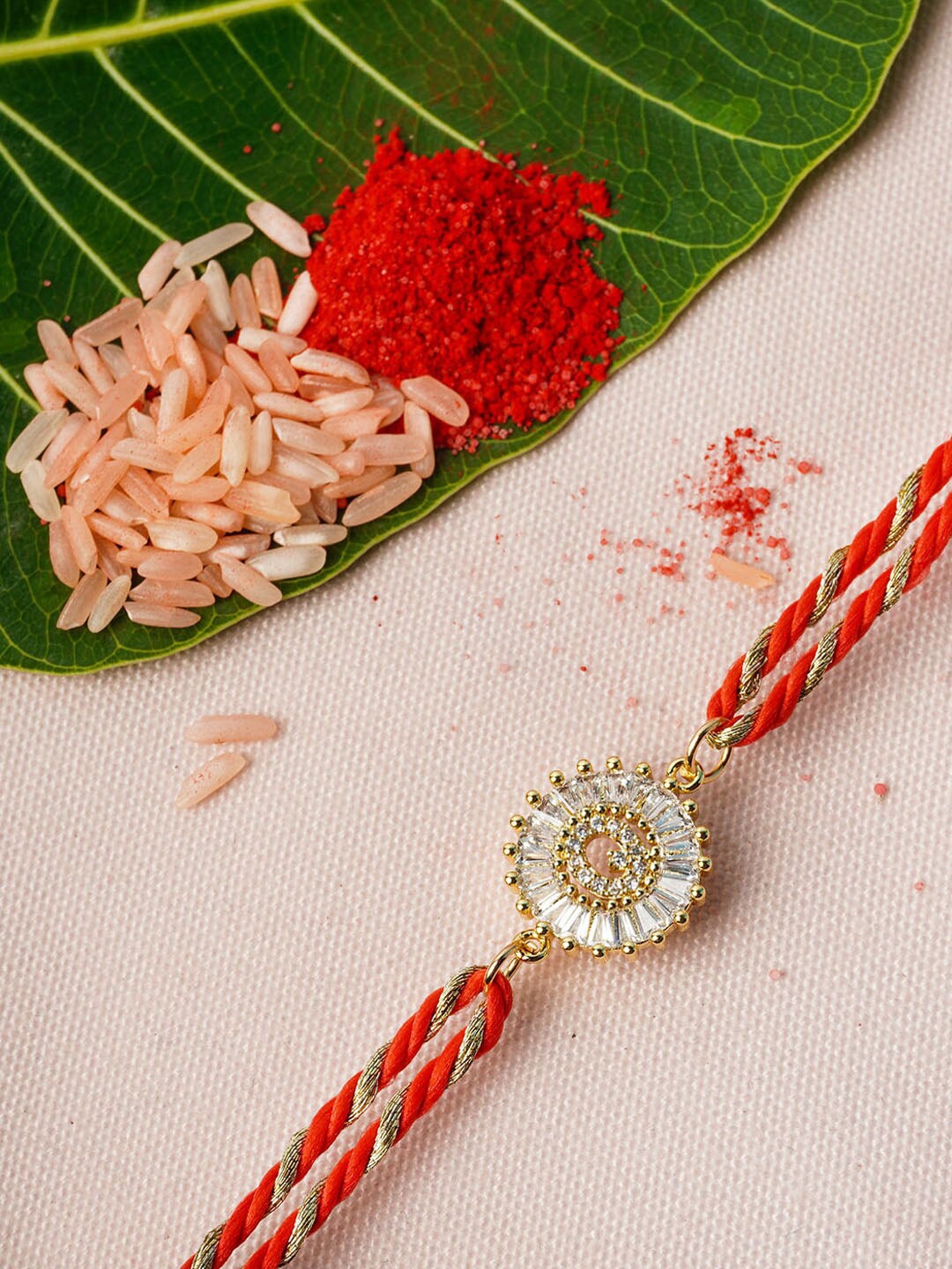 

Ferosh Red & Gold-Toned Q Alphabet Rhinestone Studded Rakhi