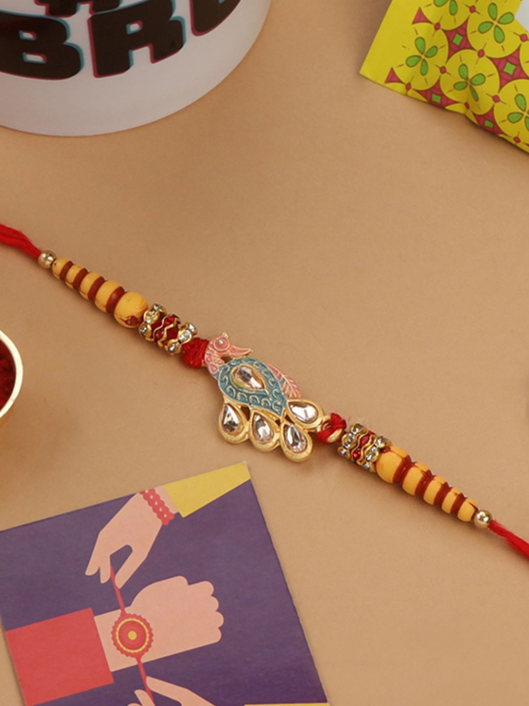 

AccessHer Women Red & Yellow Peacock Design Enamelled Rakhi