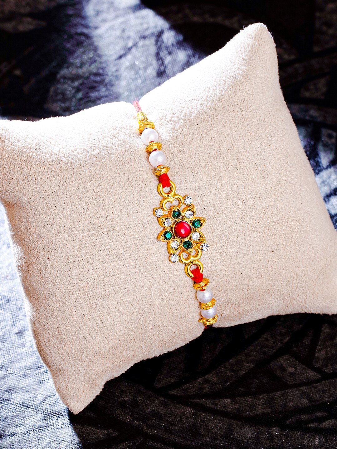 

Sukkhi Rakhi Men Red & White Gold Plated Beaded Rakhi