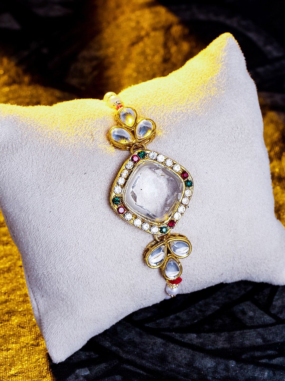 

Sukkhi Rakhi Men Gold-Plated Red & White Kundan Studded & Beaded Rakhi Set