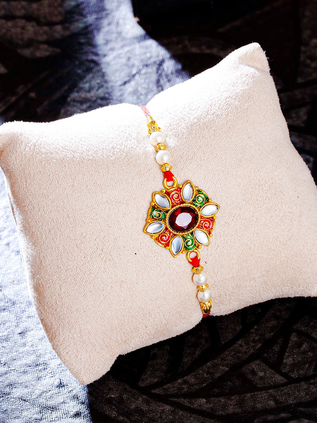 

Sukkhi Rakhi Men Gold-Plated Red Kundan Studded Meenakari Rakhi