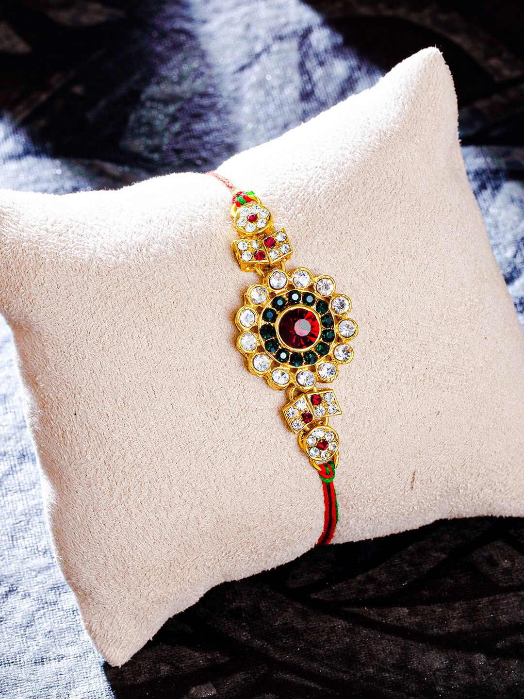 

Sukkhi Rakhi Gold-Plated Floral Rakhi with Roli Chawal & Greeting Card