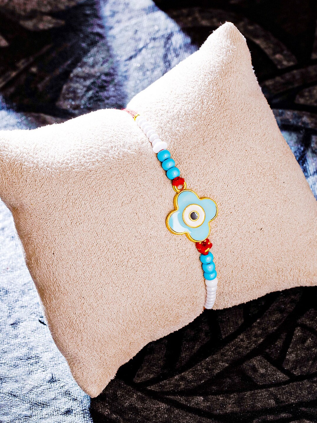 

Sukkhi Rakhi Blue Gold-Plated Evil Eye Rakhi