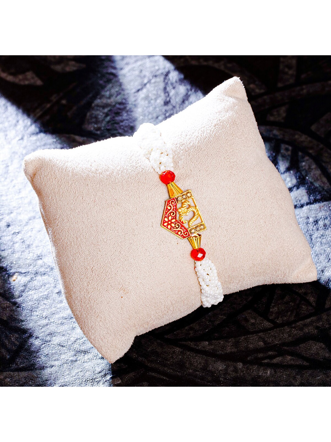 

Sukkhi Rakhi Red & Gold-Plated Om Studded Rakhi