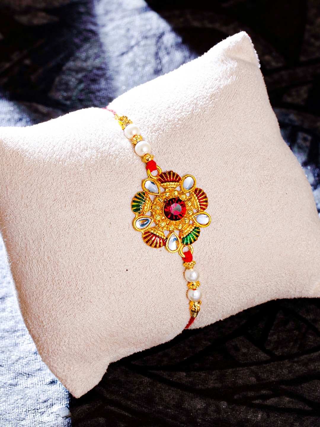 

Sukkhi Rakhi Men Gold Plated Kundan Meenakari Rakhi with Roli Chawal and Rakhi Greeting Card