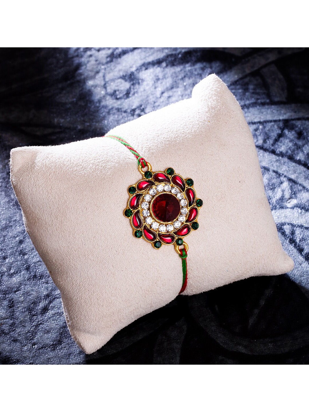 

Sukkhi Rakhi Gold Plated Floral Rakhi with Roli Chawal & Greeting Card