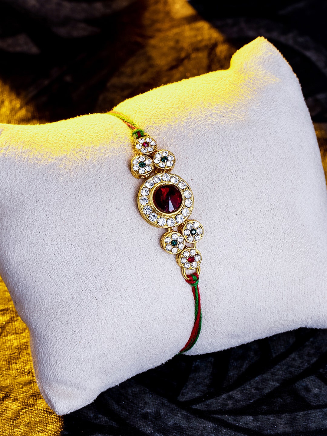 

Sukkhi Rakhi Red & Gold-Toned & Plated Studded Rakhi
