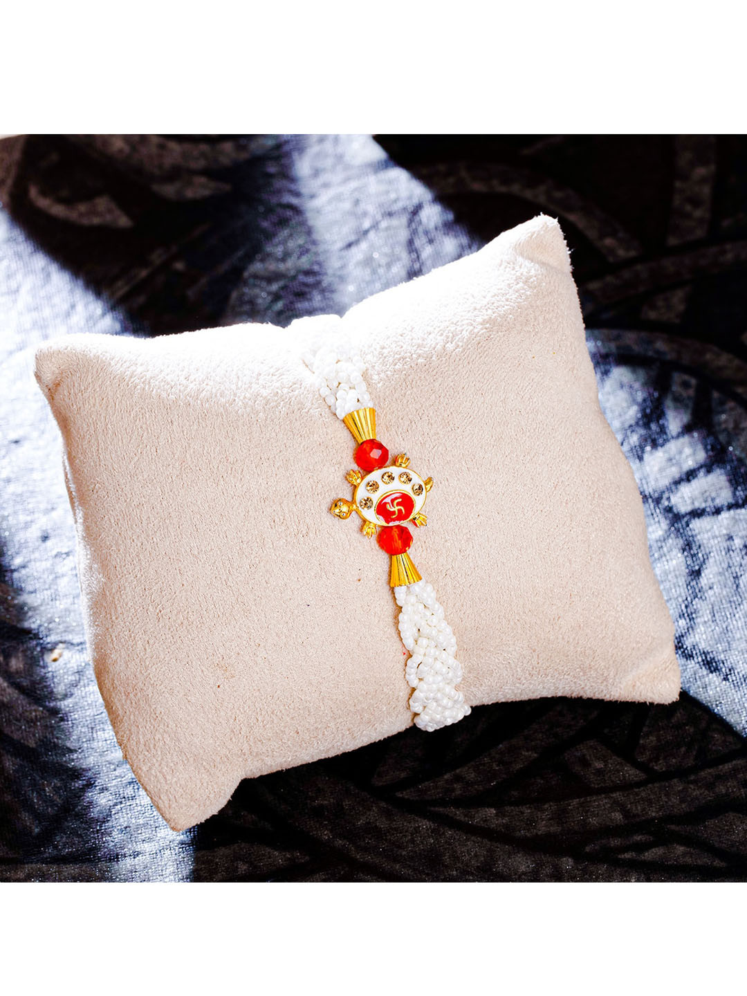 

Sukkhi Rakhi Gold-Plated Beaded Rakhi With Roli Chawal and Rakhi Greeting Card, Red