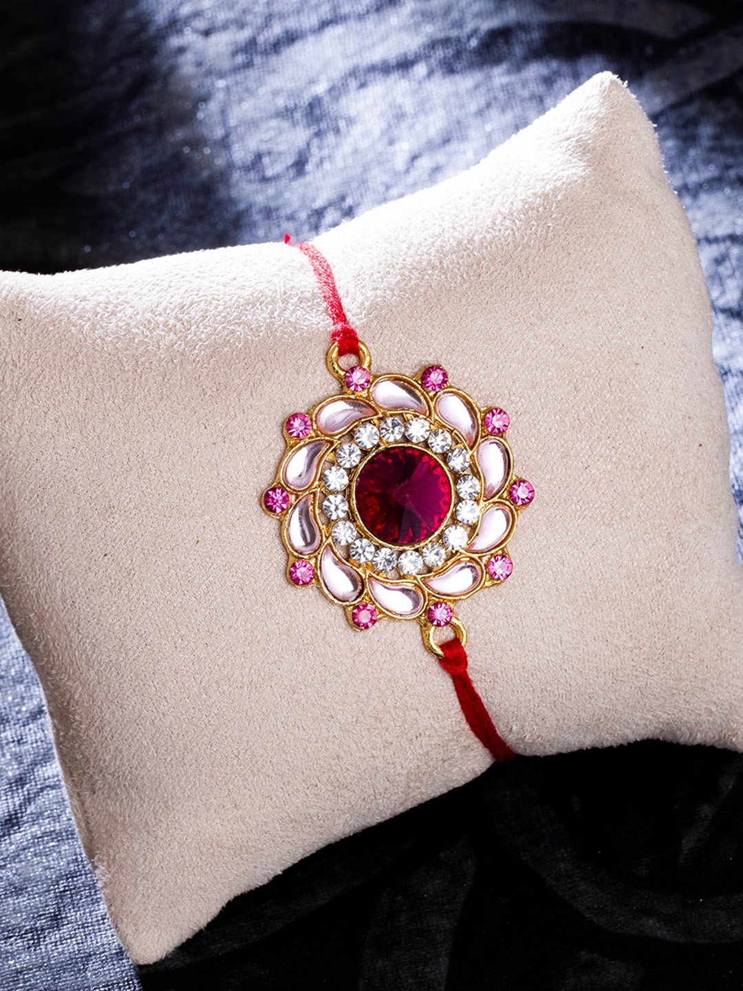 

Sukkhi Rakhi Men Gold-Plated Pink Kundan Thread Rakhi