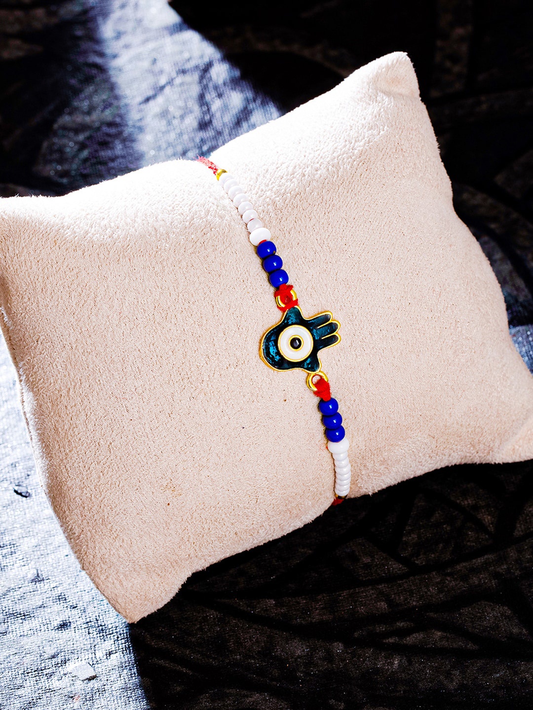 

Sukkhi Rakhi 3 Pieces Blue Glitzy Gold Plated Evil Eye Rakhi Combo