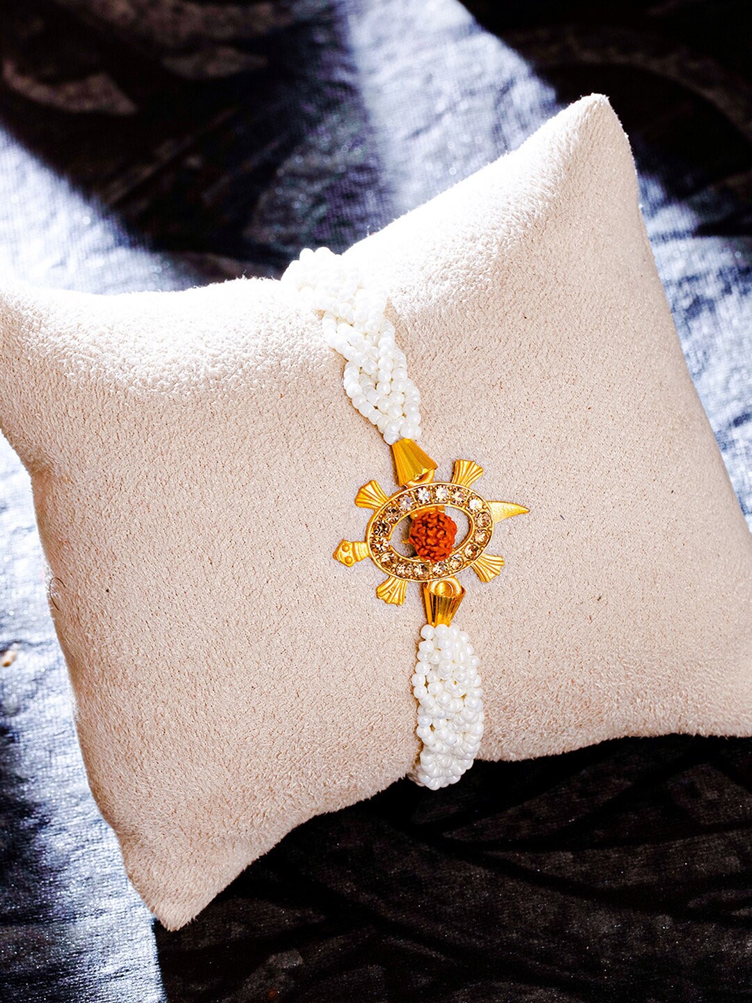 

Sukkhi Rakhi Gold-Plated Turtle Rudraksha Rakhi with Roli Chawal & Greeting Card