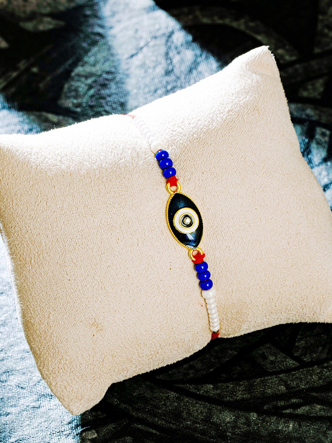 

Sukkhi Rakhi Blue Gold-Plated Evil Eye Rakhi