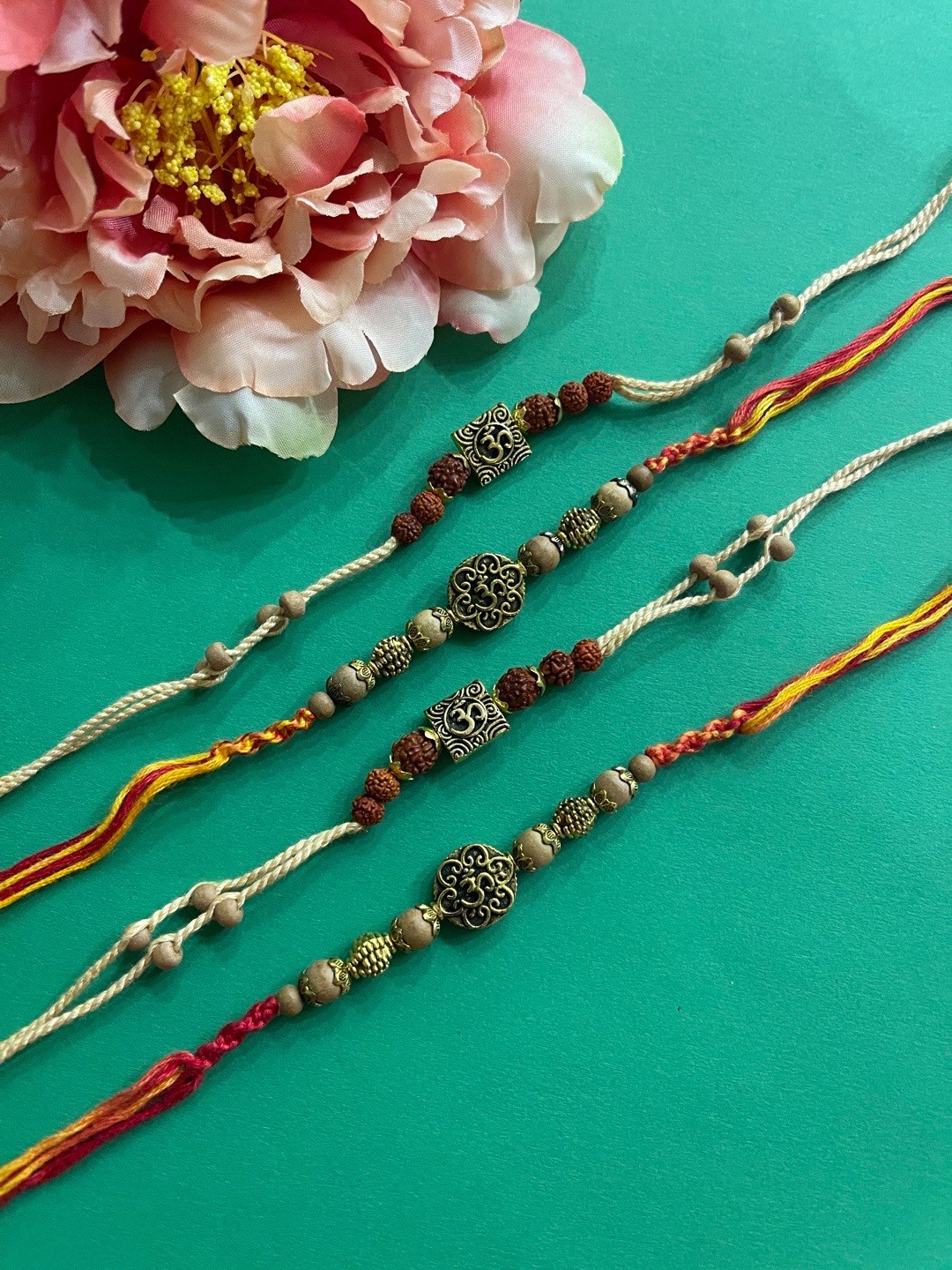 

Digital Dress Room Men Set of 4 Gold-Toned Rudraksha & chandan Beaded Rakhi