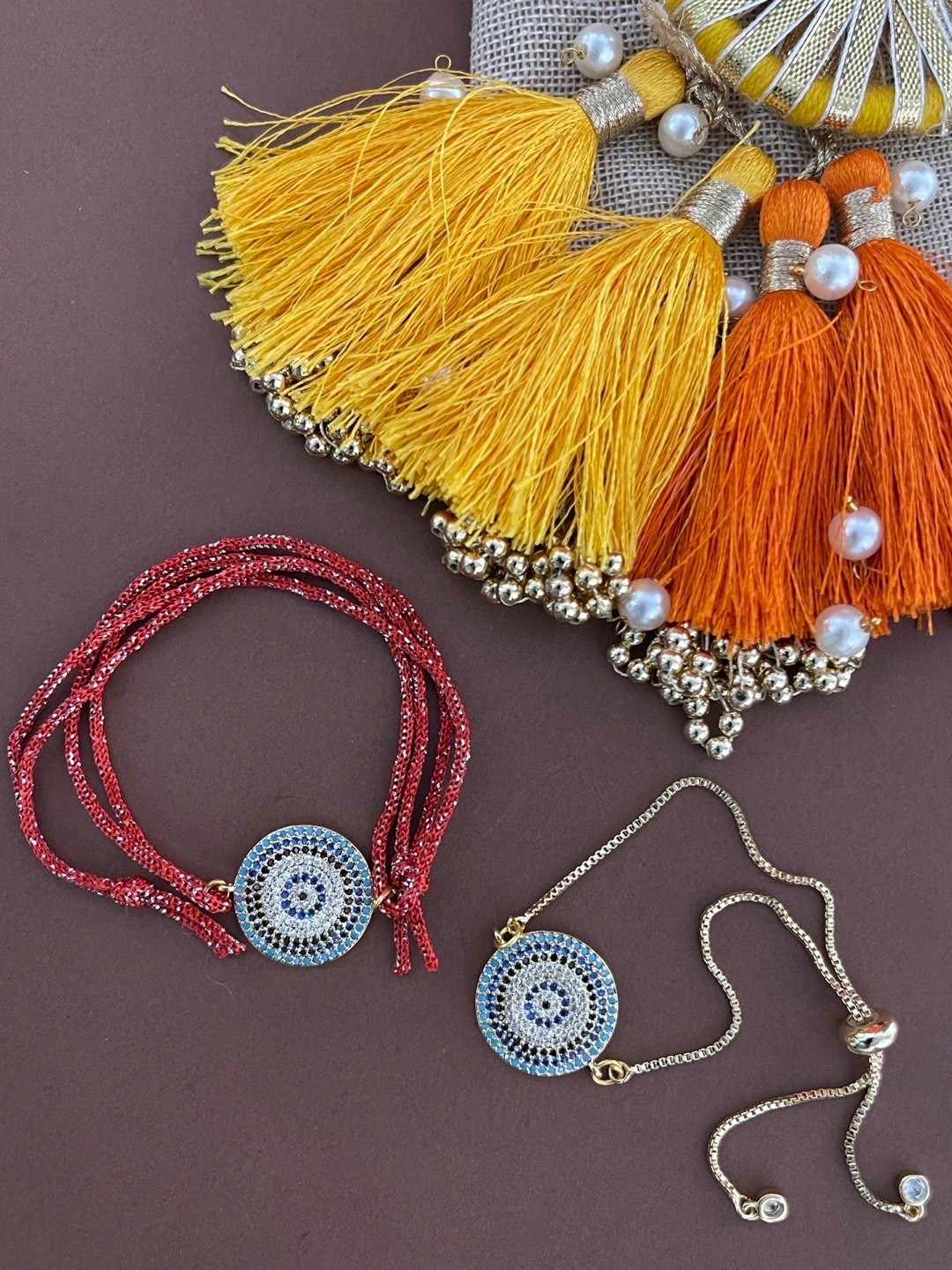

Digital Dress Room Set Of Two Red & Gold Men Rakhi