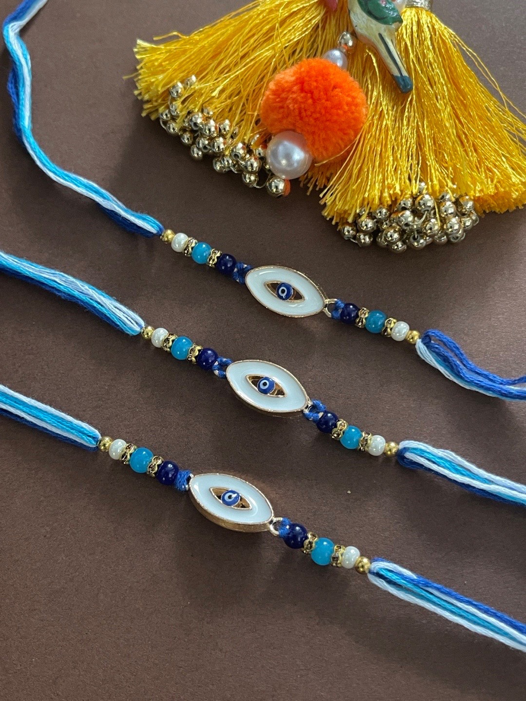 

Digital Dress Room Men Set of 3 Blue Evil Eye Gold Toned Designed Rakhi