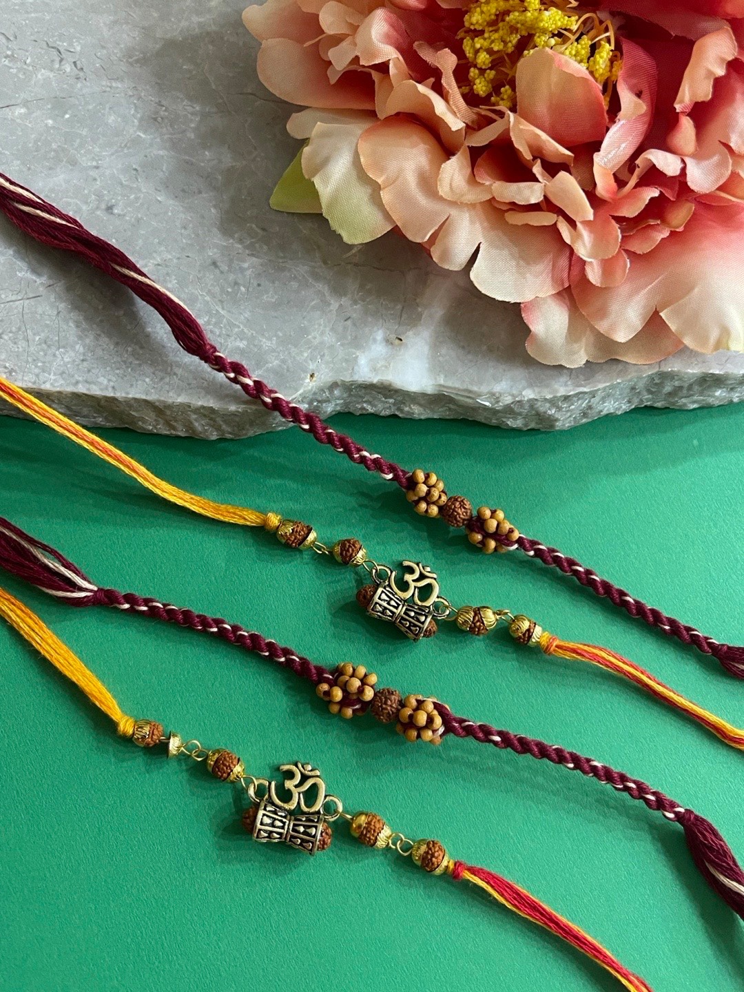 

Digital Dress Room Men Set of 4 Gold-Toned Rudraksha Beaded Om Rakhi