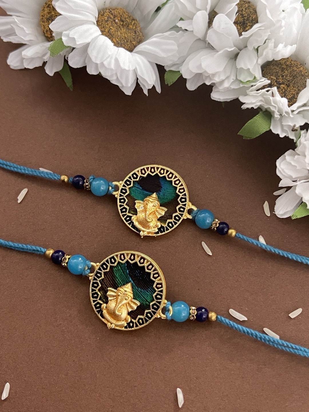 

Digital Dress Room Men Set Of 2 Gold-Colored Blue Peacock Feather Lord Ganesha Rakhi