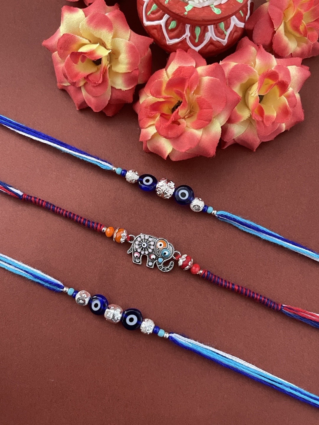 

Digital Dress Room Men Set of 3 Blue & Purple Gold-Plated White Stone Studded Rakhi