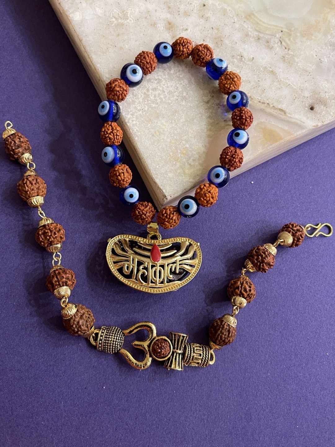 

Digital Dress Room Men Set of 2 Gold-Toned & Brown Rudraksha & Evil-Eye Beaded Om Rakhi
