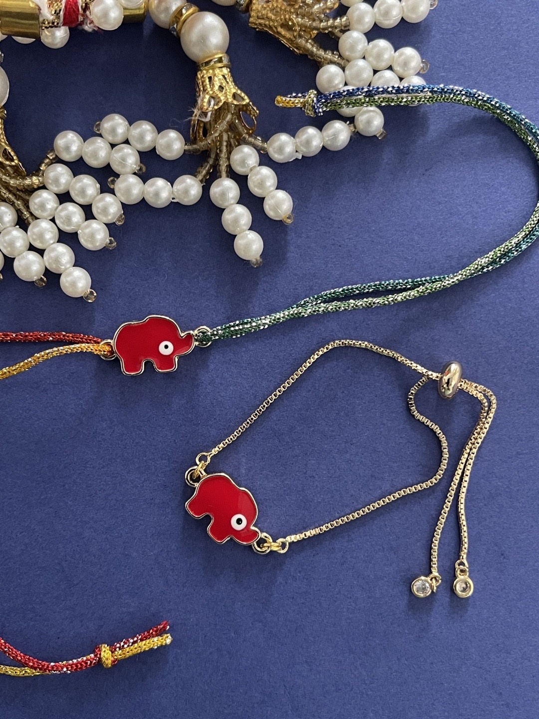 

Digital Dress Room Men Pack Of 2 Gold-Toned & Red Designed Rakhi