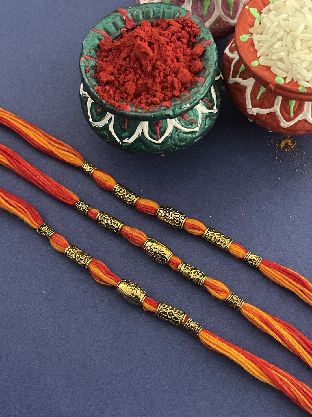 

Digital Dress Room Men Set of 3 Gold-Toned & Red Beaded Rakhi