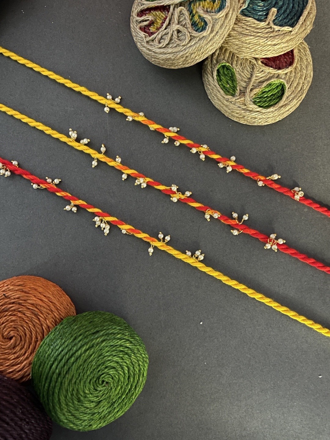 

Digital Dress Room Men Pack Of 3 Gold-Toned Pearl Mauli designed Rakhi