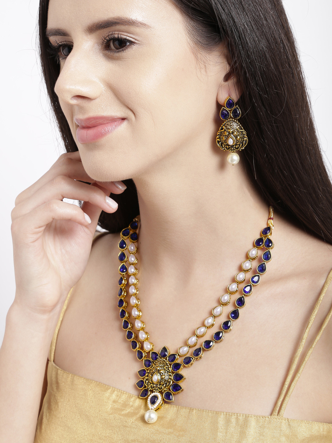 

Zaveri Pearls Antique Gold-Toned & Blue Embellished Jewellery Set