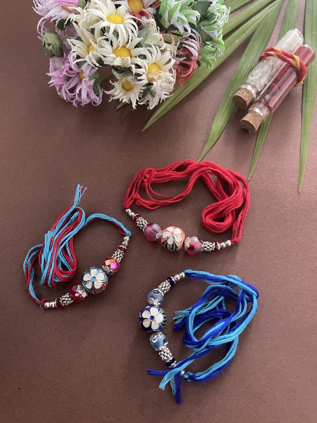 

Digital Dress Room Men Set Of 3 Silver-Toned Blue & Maroon Beaded Rakhi