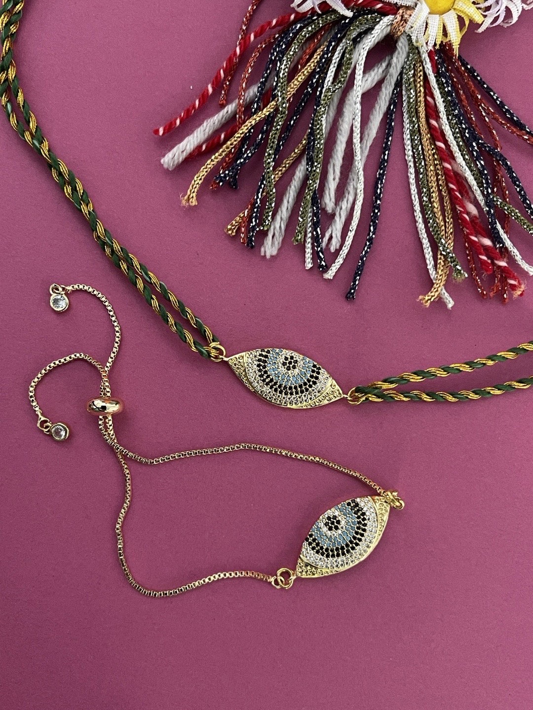 

Digital Dress Room Set Of 2 Gold Plated Evil Eye AD Studded Rakhi Bhaiya-Bhabhi Rakhi