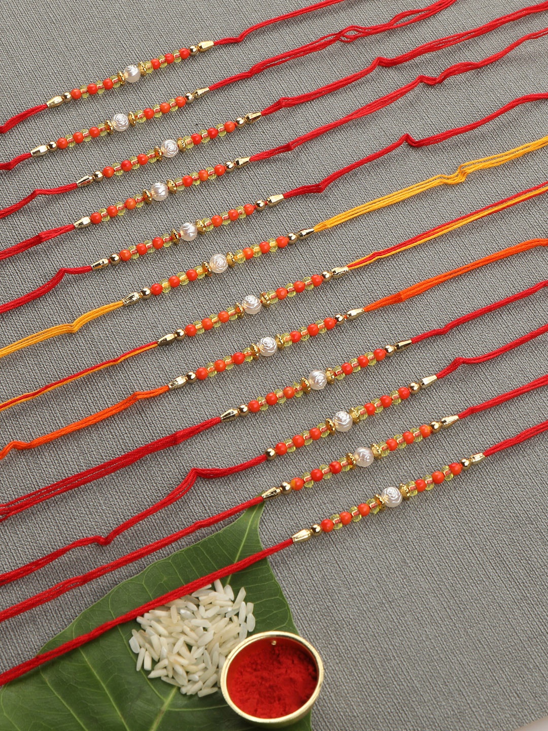 

AccessHer Set Of 12 Red & Gold-Toned Beaded Rakhi
