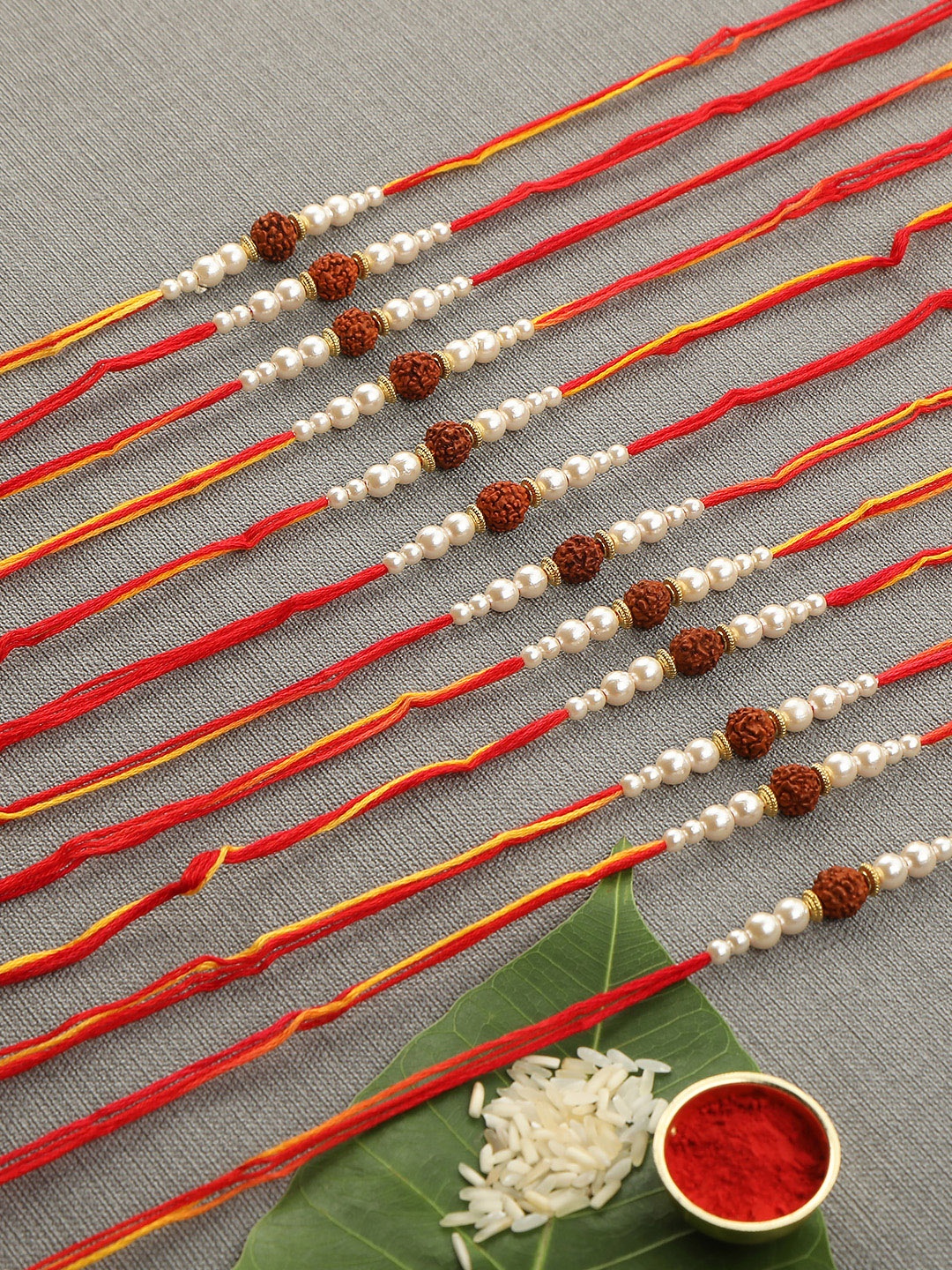 

AccessHer Set of 12 Rudraksh Rakhi With Pearls, Multi