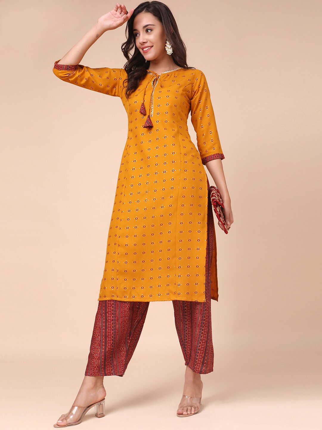 

MOKOSH Women Mustard Yellow Ethnic Motifs Panelled Kurti with Trousers