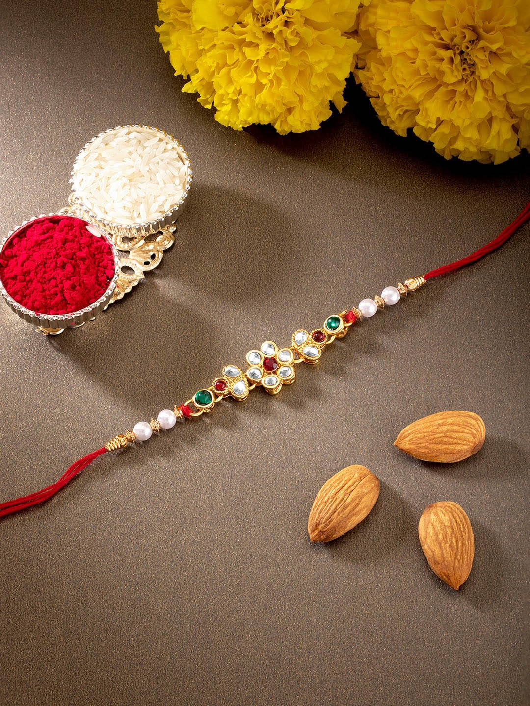 

Peora Men Gold-Toned & Red Kundan Studded Floral Rakhi with Chawal Roli Greeting Card