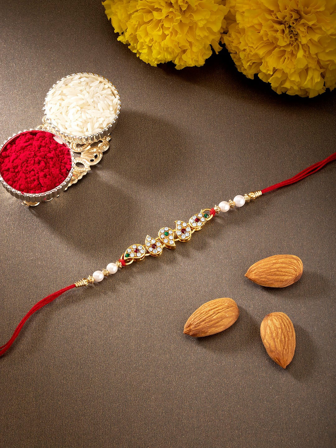 

Peora Gold Toned & Red Thread Rakhi With Chawal Roli & Greeting Card