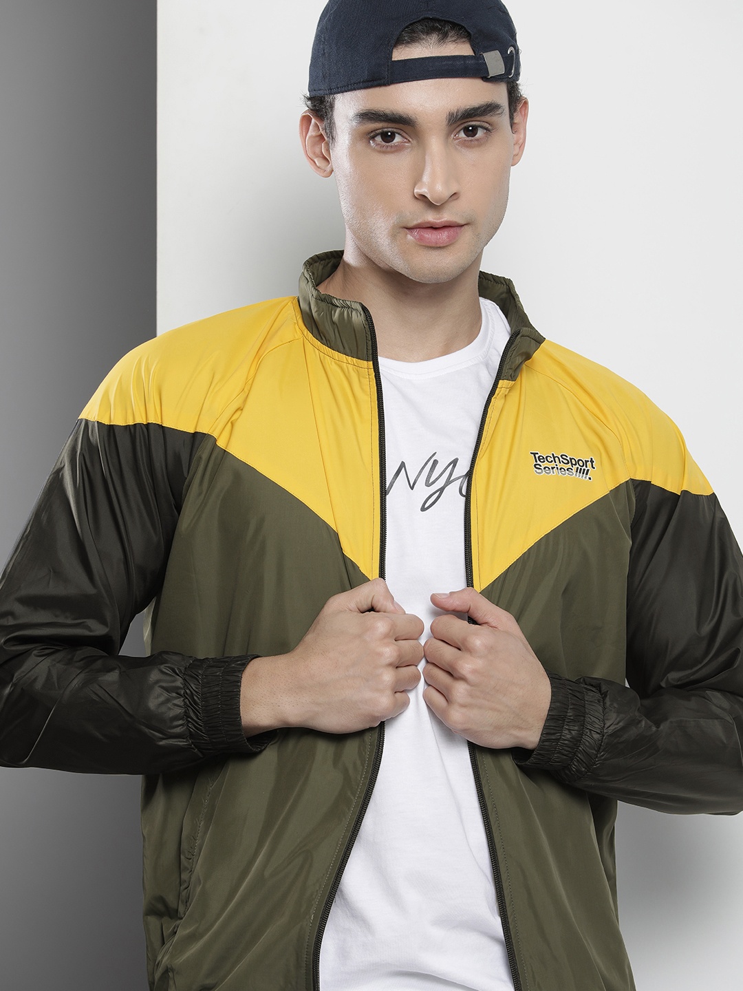 

The Indian Garage Co Men Olive Green & Yellow Colourblocked Windcheater Jacket