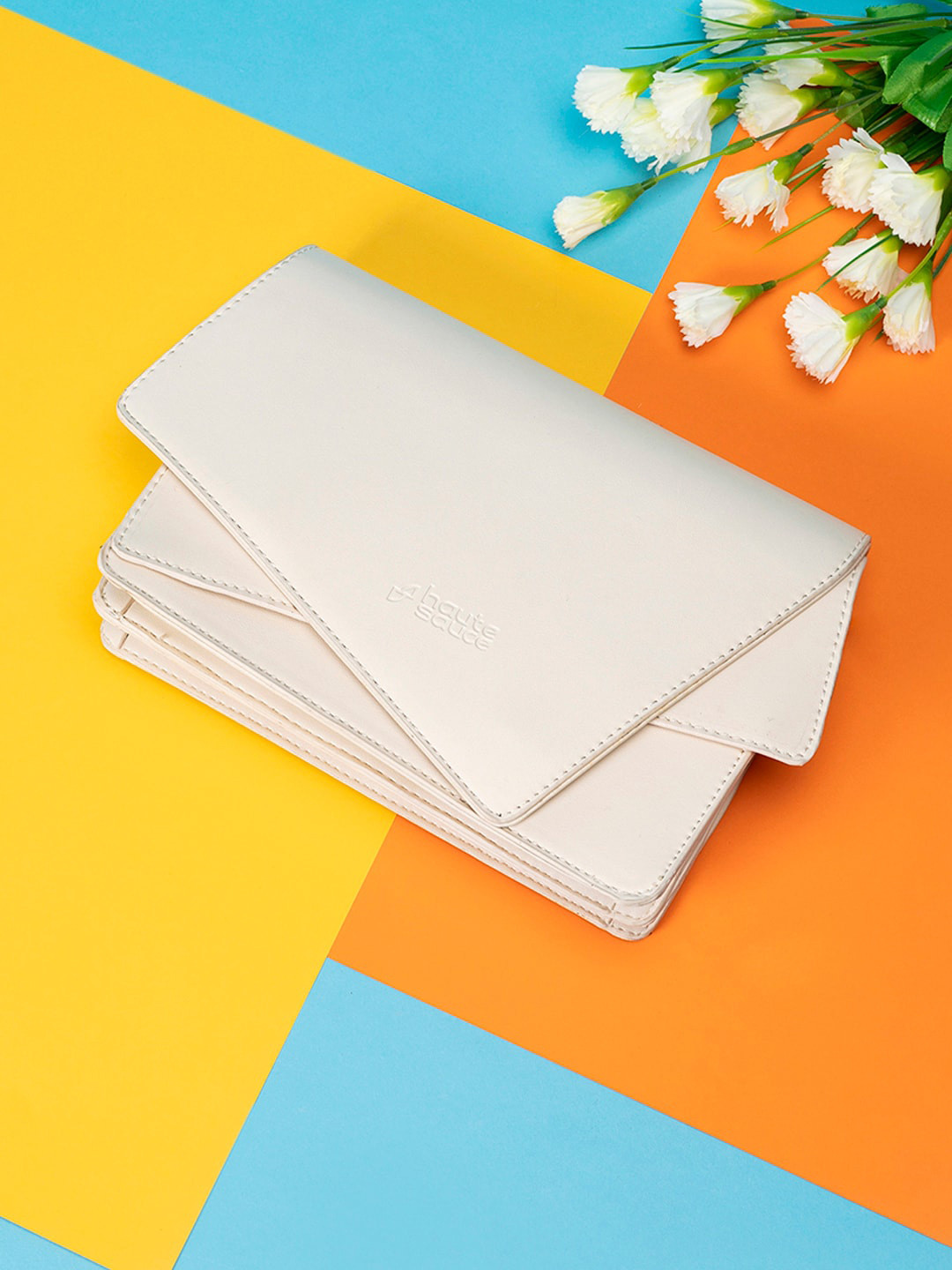 

HAUTE SAUCE by Campus Sutra White Asymmetrical Envelope Clutch