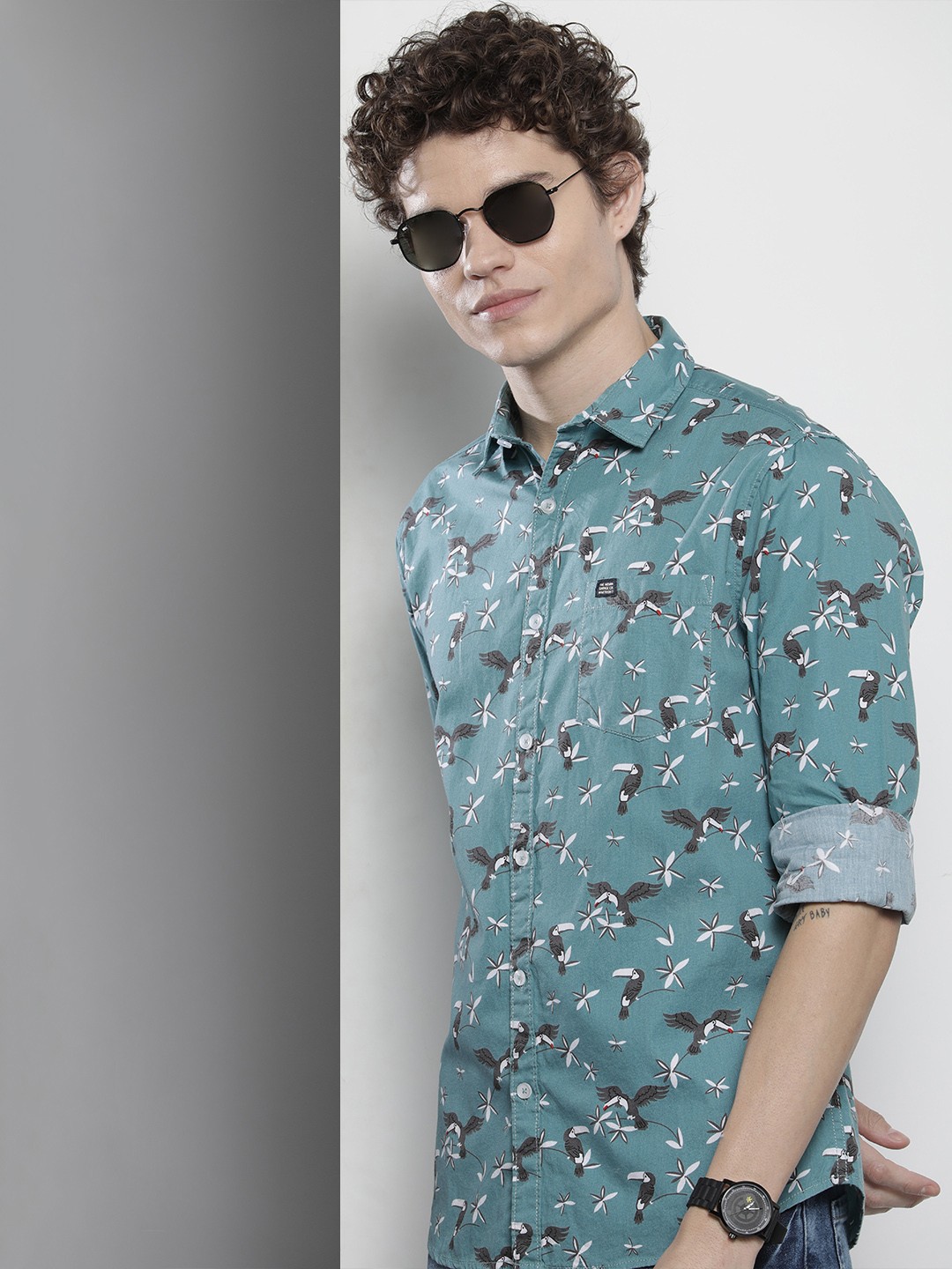 

The Indian Garage Co Men Blue & Brown Conversational Printed Casual Shirt