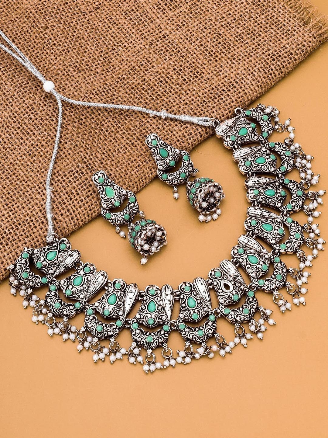 

aadita Oxidised Silver-Plated Green & White Stone-Studded & Beaded Jewellery Set