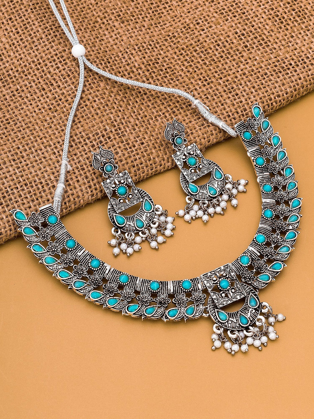 

aadita Silver-Plated Blue Stone-Studded & Beaded Jewellery Set