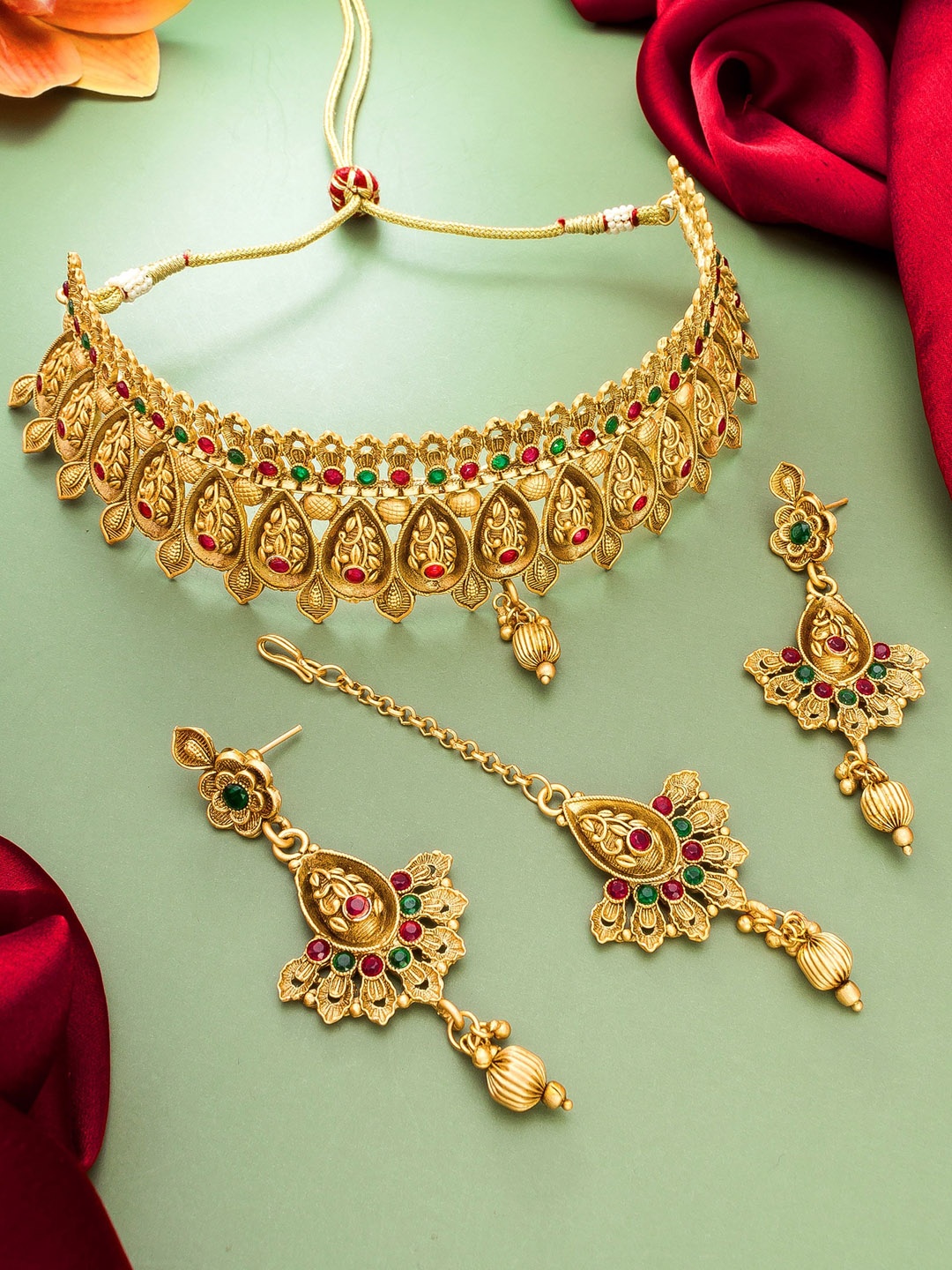 

aadita Gold-Plated Red & Green Stone-Studded & Beaded Jewellery Set