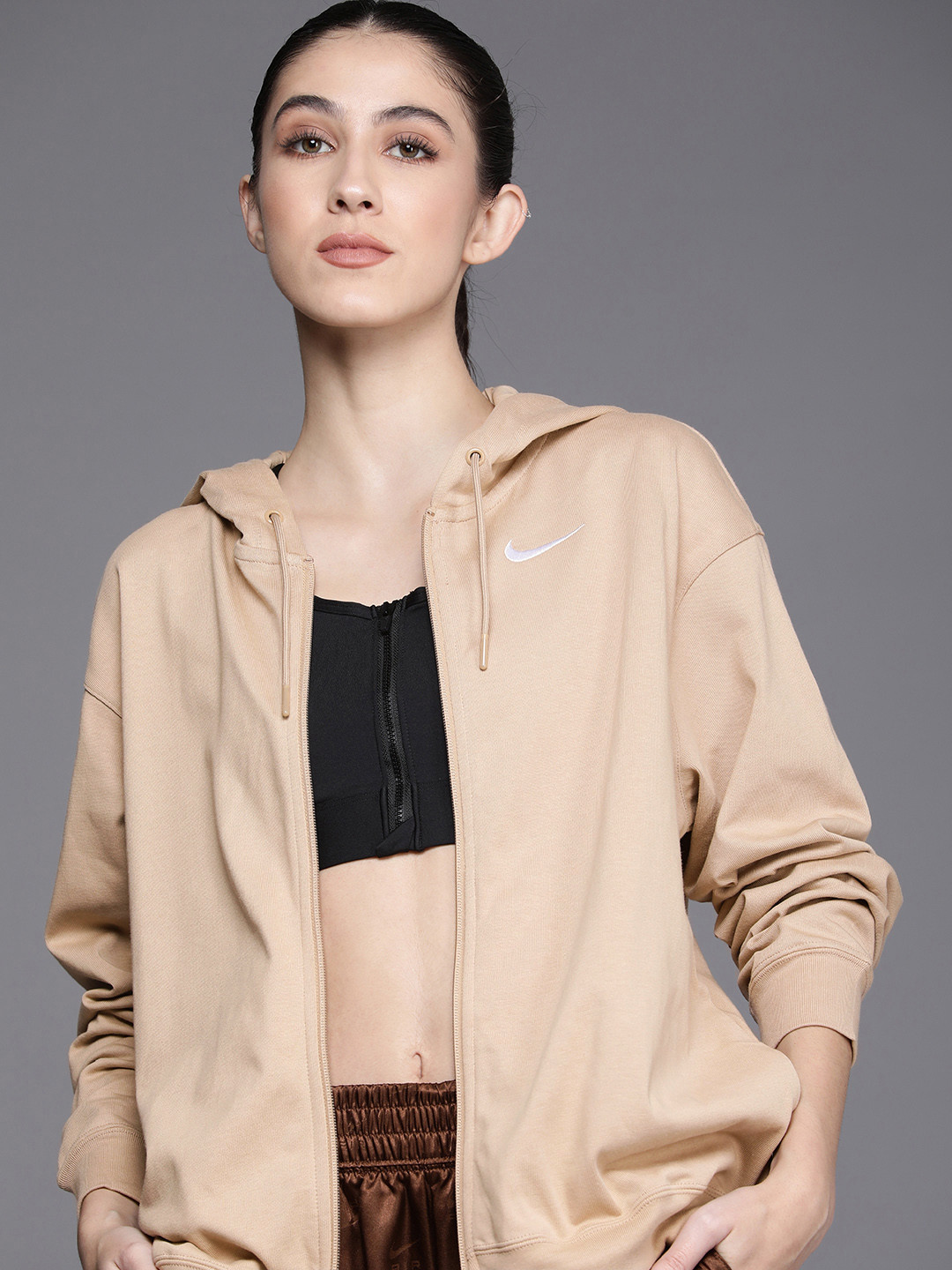 

Nike Women Beige Solid NSW JRSY OS FZ Hooded Bomber Jacket
