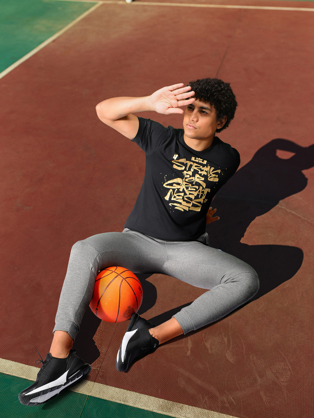 

Nike Men Black & Gold-Toned Typography Printed Pure Cotton T-shirt