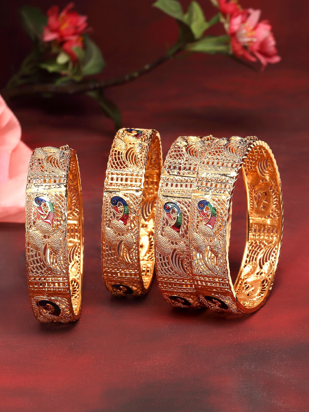 

Kennice Women Set Of 4 Gold Plated Blue Textured Peacock With Cut Out Bangles