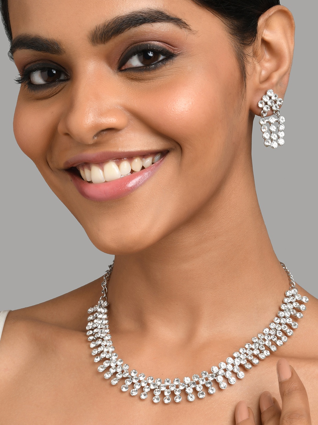 

Fida Silver-Toned & White Rhodium Plated American Diamond Studded Jewellery Set