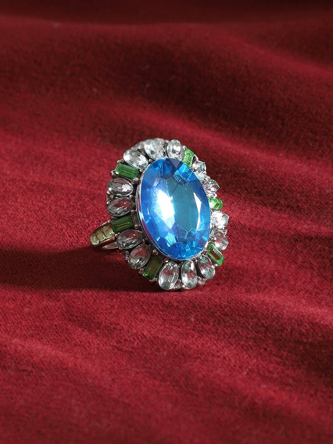 

Yellow Chimes Silver-Plated Blue Crystal & Green Stone Studded Ring