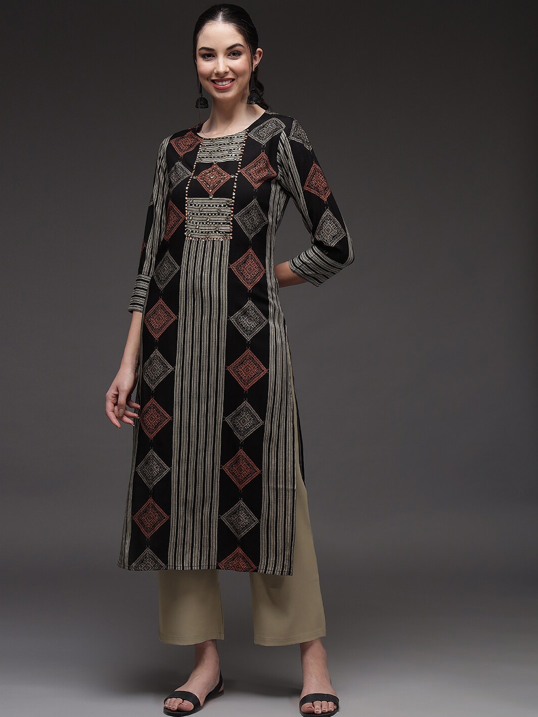 

Pankvi Women Black & Rust Geometric Striped Kurta