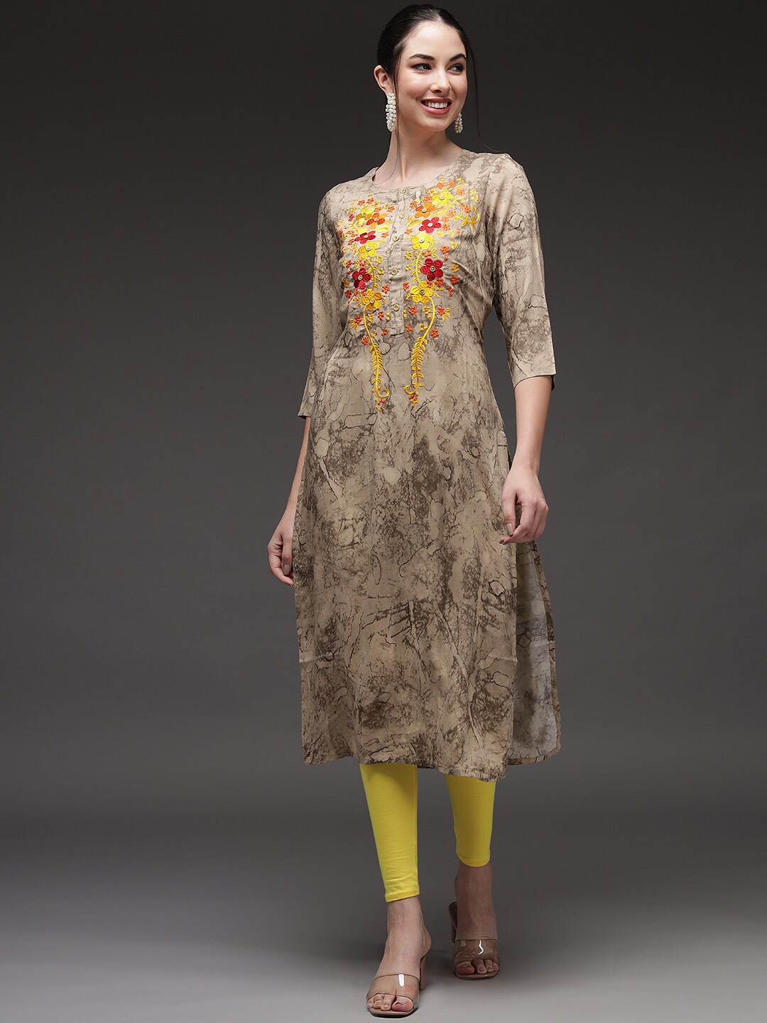 

Pankvi Women Beige & Yellow Floral Embroidered Floral Kurta
