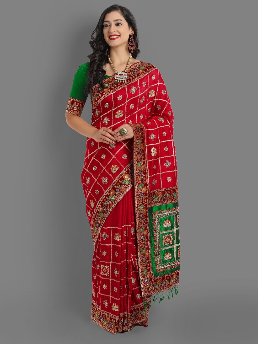 

Ekta Textiles Red & Green Ethnic Motifs Zari Silk Blend Patola Saree