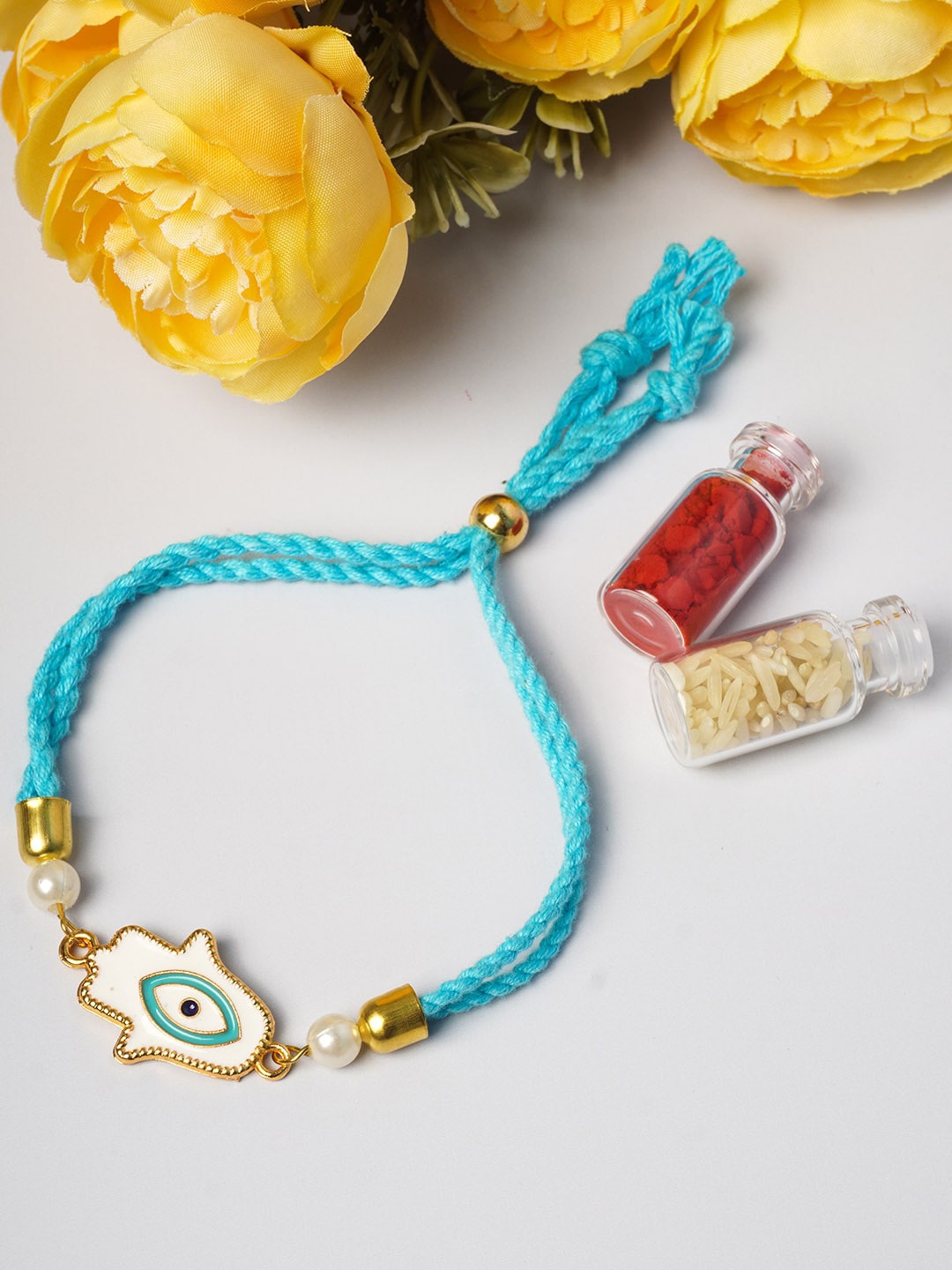 

Ferosh Turquoise Blue & White Hamsha Hand Rakhi
