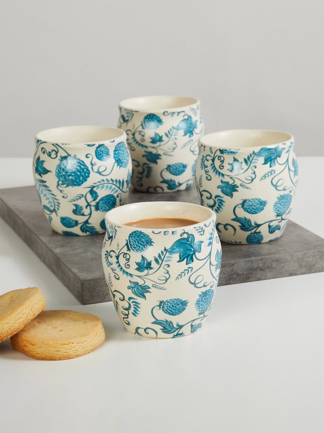 

Home Centre Set Of 4 White & Blue Dishware safe Stoneware Glossy Kulladhs 180ml each